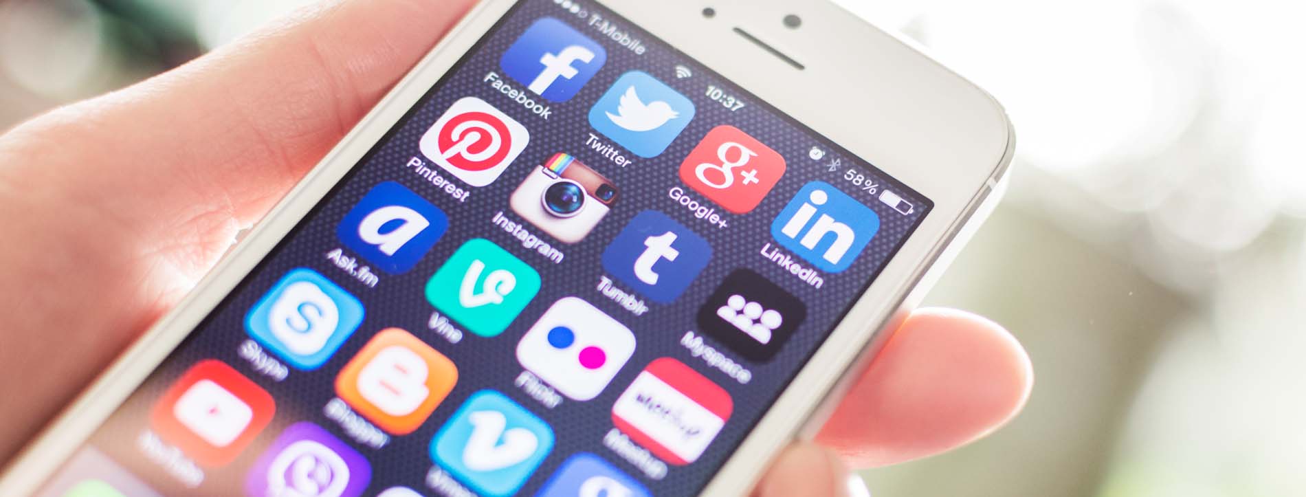 person holding an iphone with social media apps on it, social media marketing